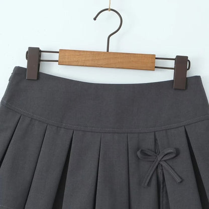 Low-Rise Bow Accent Pleated Slit Mini A-Line Skirt