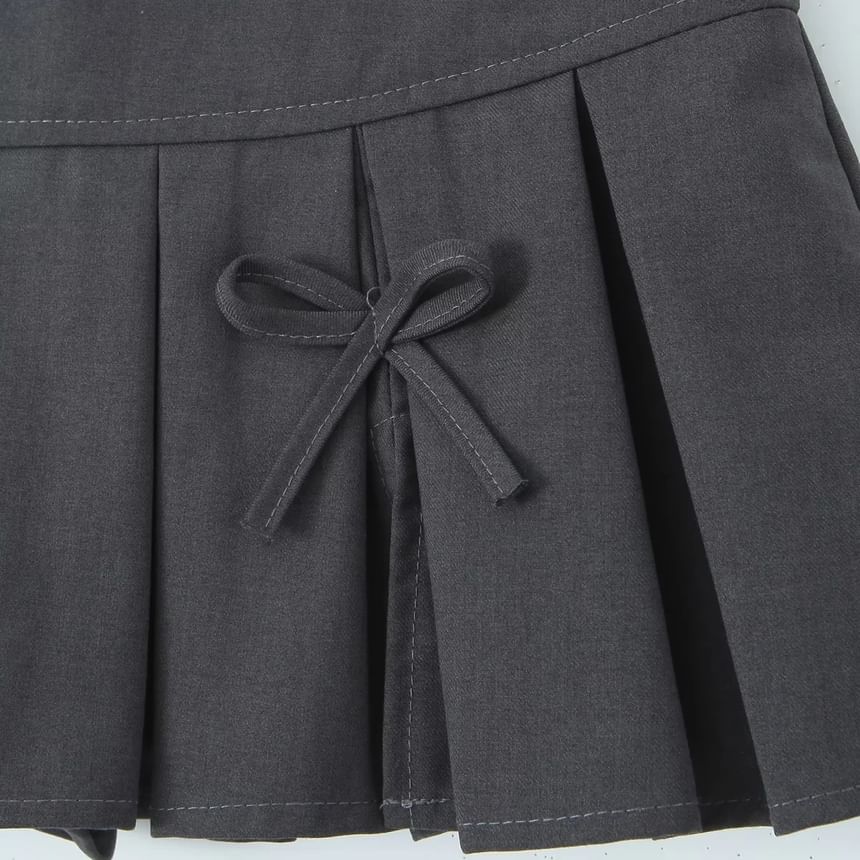 Low-Rise Bow Accent Pleated Slit Mini A-Line Skirt