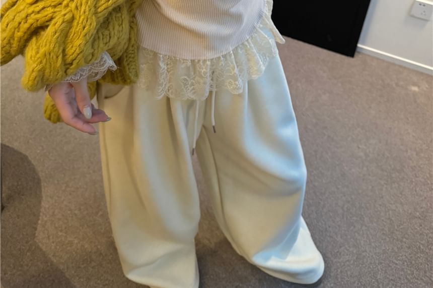 Crewneck Knit Sweater, Sleeveless Lace Camisole, and High-Waist Wide-Leg Trousers
