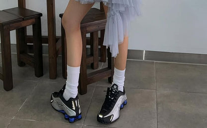 Asymmetric Flounce Mini Skirt with Mesh Insets