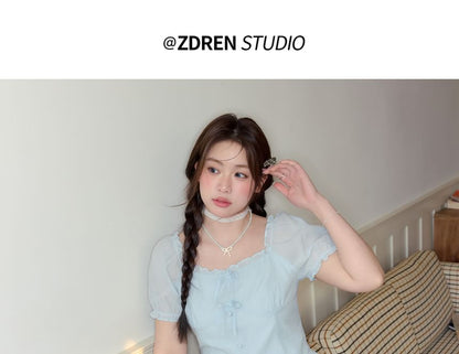 Set: Puff-Sleeve Square Neck Plain Bow Accent Frill Trim Slit Crop Blouse + High Waist Mini A-Line Skirt