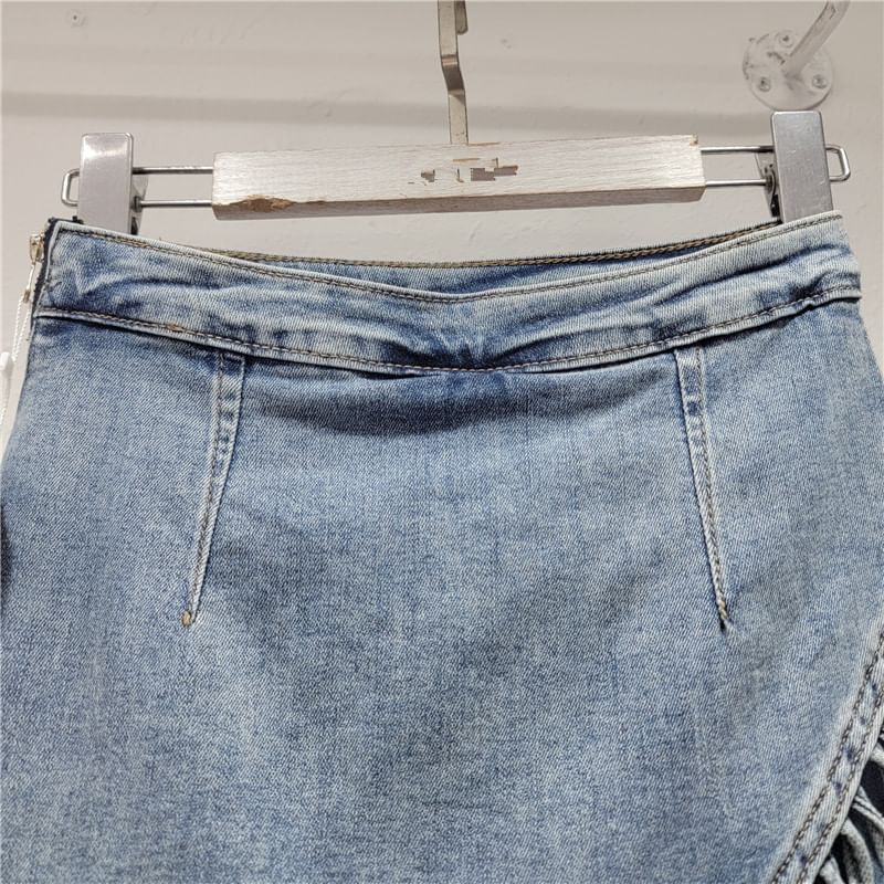 Mid Rise Asymmetrical Fringed Washed Denim Skort
