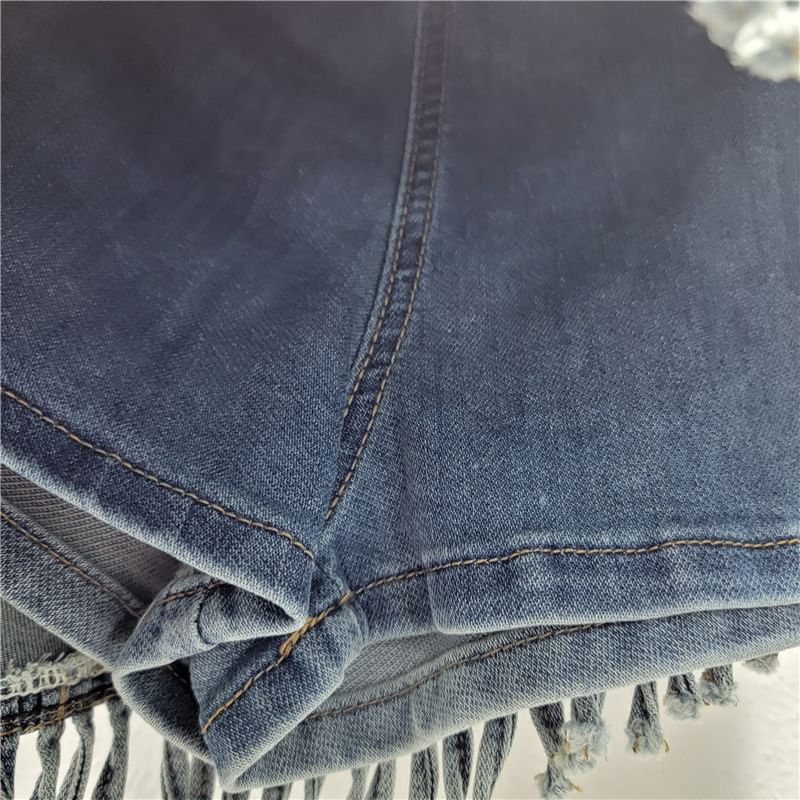 Mid Rise Asymmetrical Fringed Washed Denim Skort