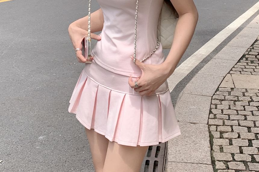 Polo Shirt & Pleated Mini Skirt