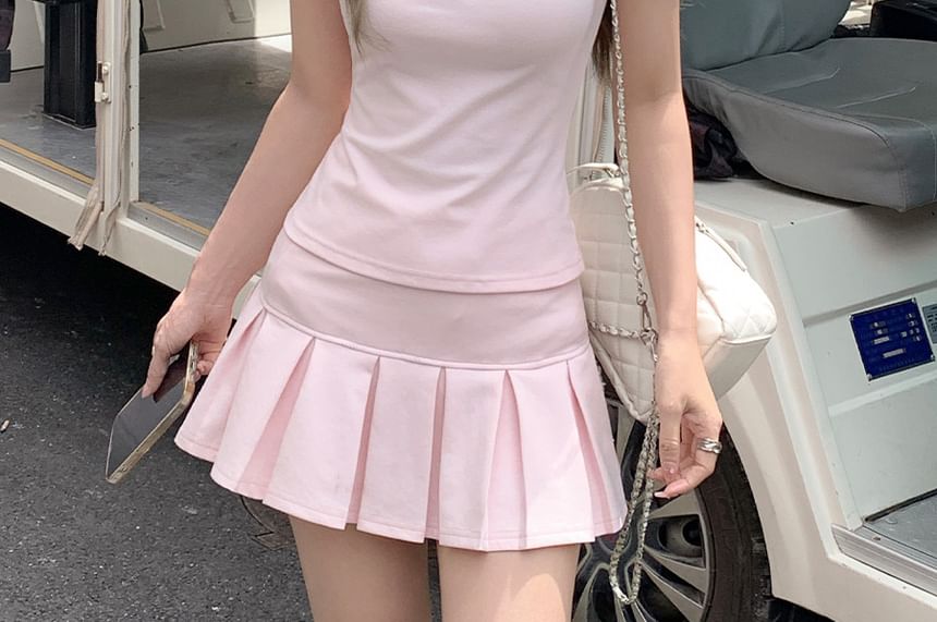 Polo Shirt & Pleated Mini Skirt