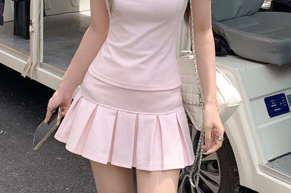 Polo Shirt & Pleated Mini Skirt