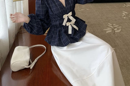 Peplum Blouse with Plaid Pattern and Bow Accent at V-Neck