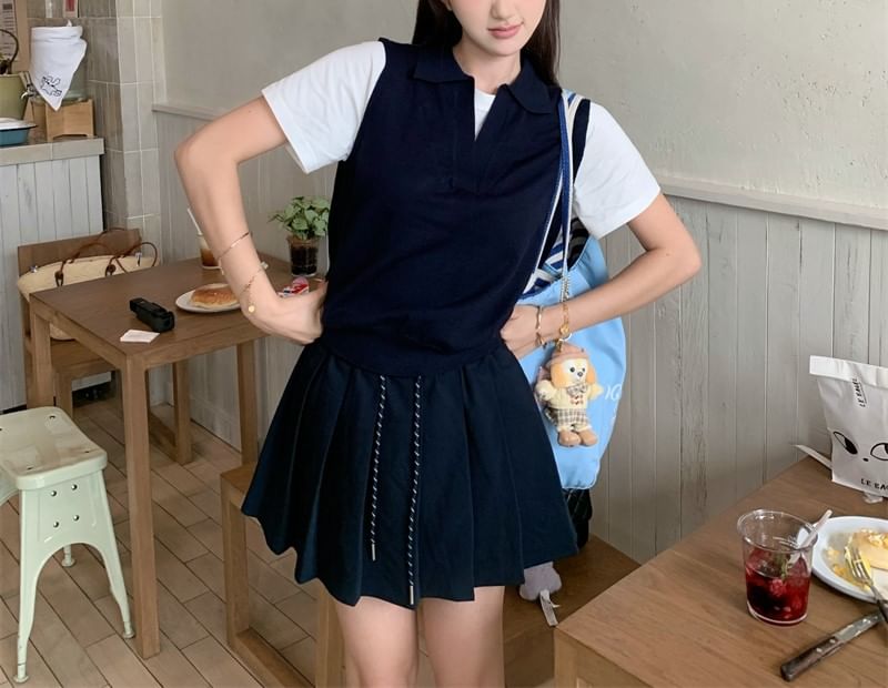 Mock Two-Piece Polo Top with Short Sleeves and Mini Pleated Skirt