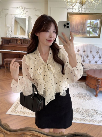 Dotted Ruffled Blouse with Puffed Sleeves and Neck Tie Detail