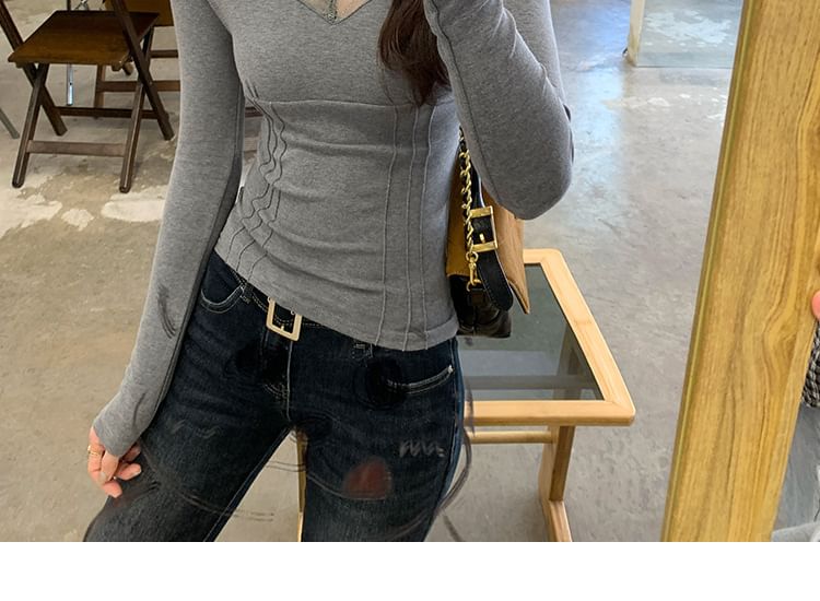 V-Neck Top with Lace Trim and Long Sleeves in Solid Color