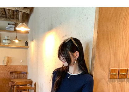 Two-Piece Style Cropped Knit Top with Round Neck and Long Sleeves