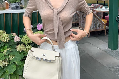 Elbow-Length Knit Top with Tied Collar and Solid Fabric