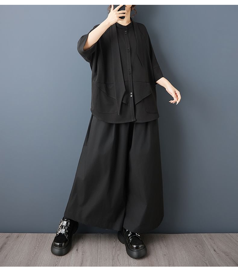 Short Sleeve Asymmetrical Solid Button-Up Blouse