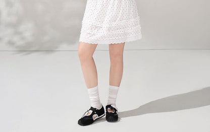 Tie-Neck Tee and Ruffled Mini Skirt