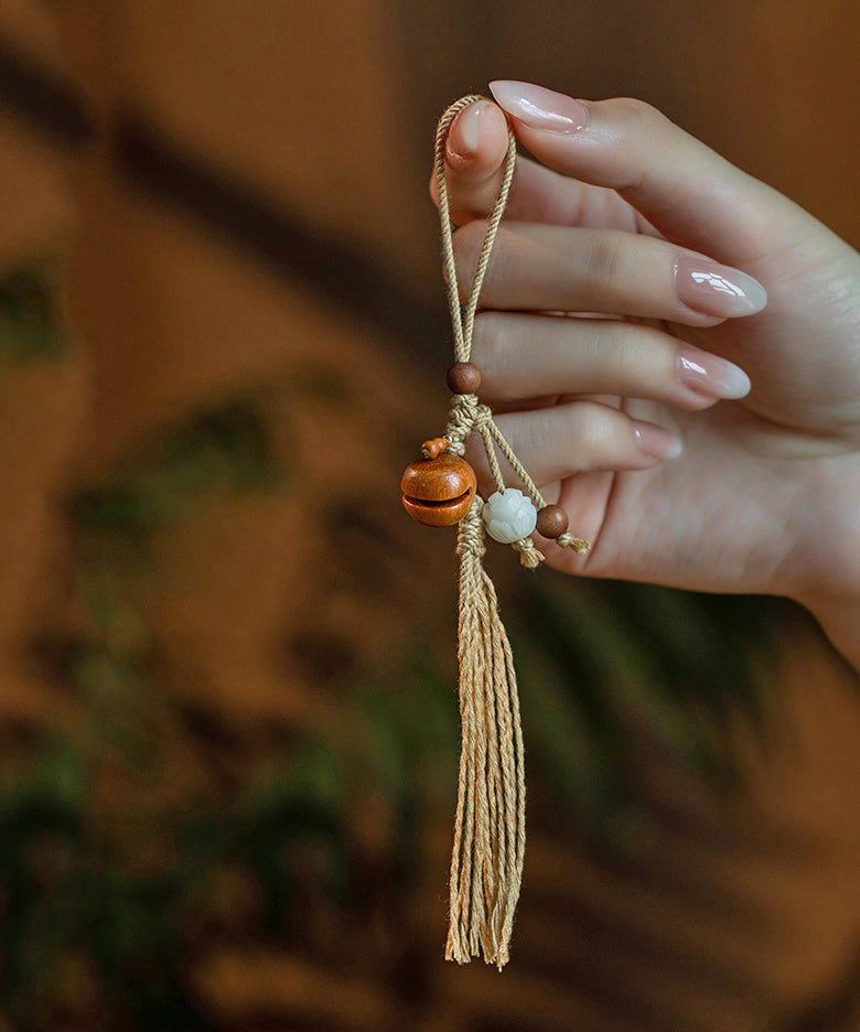 Porte-clés vintage en bois de pêcher tissé à la main jaune avec noyau d'olivier ZZ013