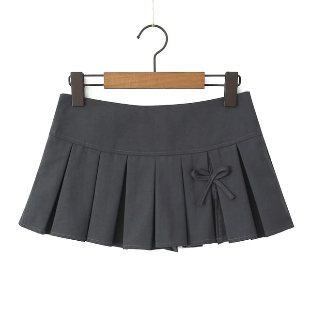 Low-Rise Bow Accent Pleated Slit Mini A-Line Skirt