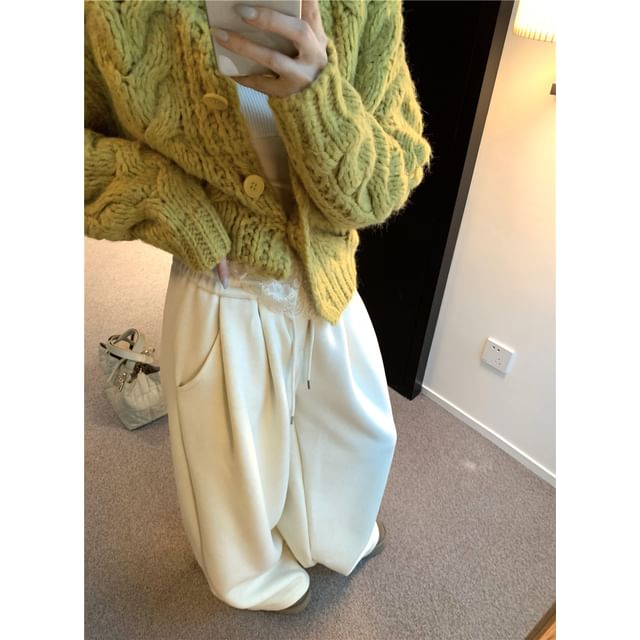 Crewneck Knit Sweater, Sleeveless Lace Camisole, and High-Waist Wide-Leg Trousers
