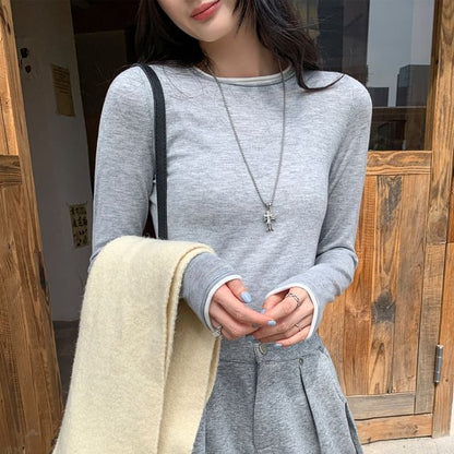 Two-Piece Style Cropped Knit Top with Round Neck and Long Sleeves