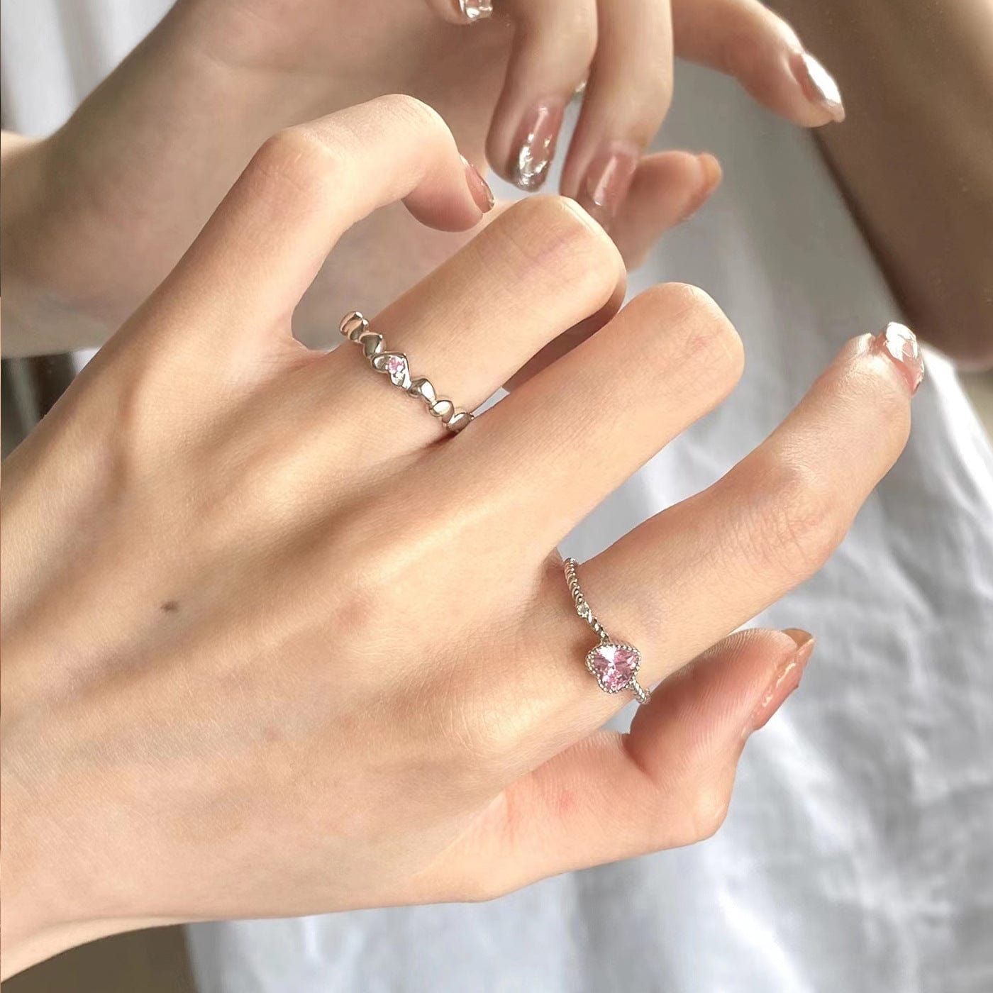 Schicker Herzring mit rosa CZ-Kristall