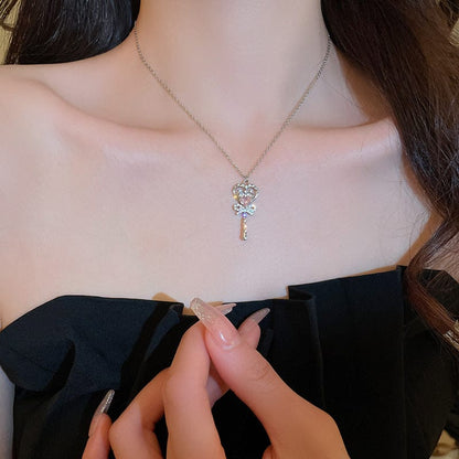 Collier baguette magique en forme de cœur avec nœud papillon