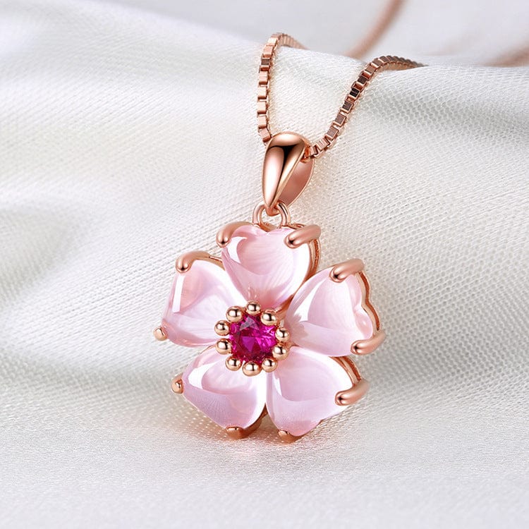 Collier avec pendentif en forme de cœur rose et fleur de cerisier