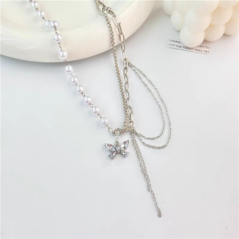 Collier de perles en cristal et papillon