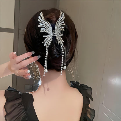 Pince à cheveux pour chignon papillon à pompon