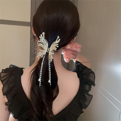 Pince à cheveux pour chignon papillon à pompon